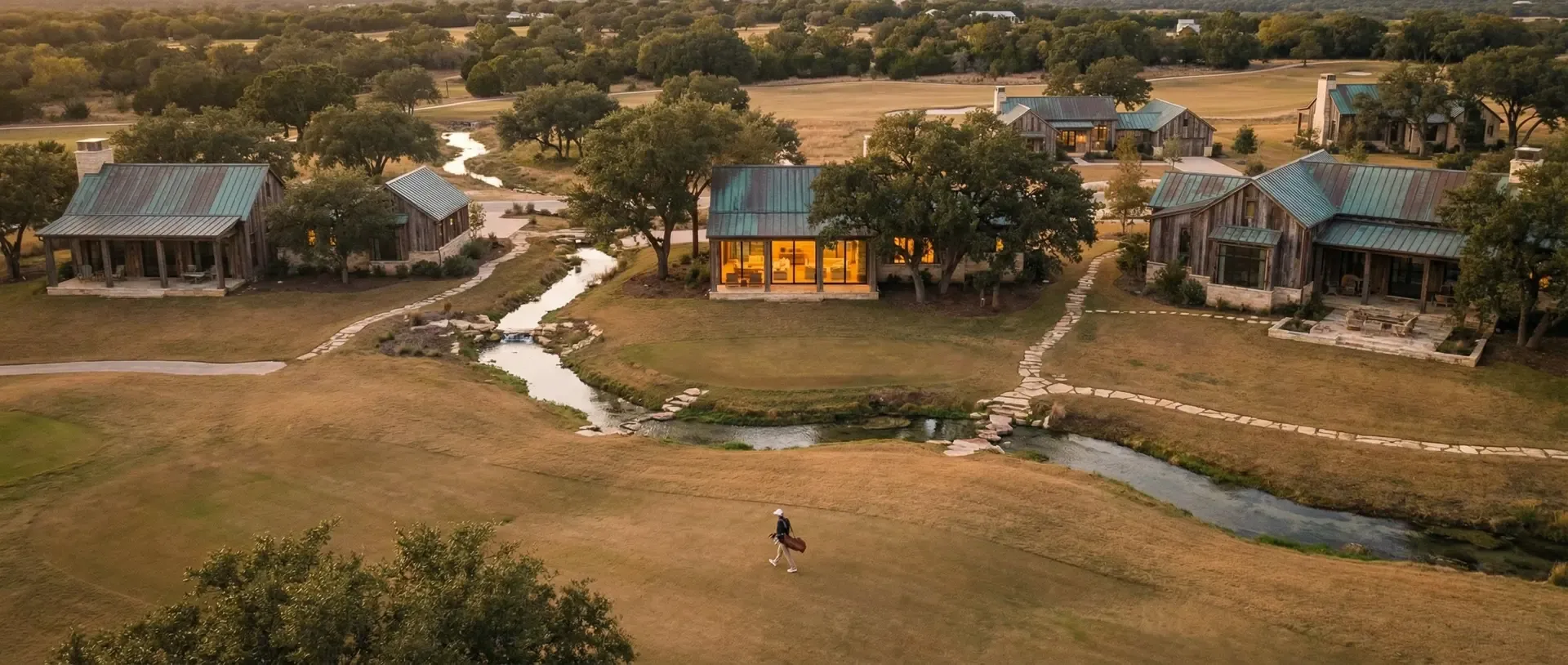 Aerial view of luxury homes nestled into a golf course landscape